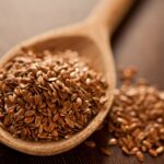 close-up-of-brown-flaxseeds-on-spoon-at-table-672217081-5b50b1a346e0fb0037743e72